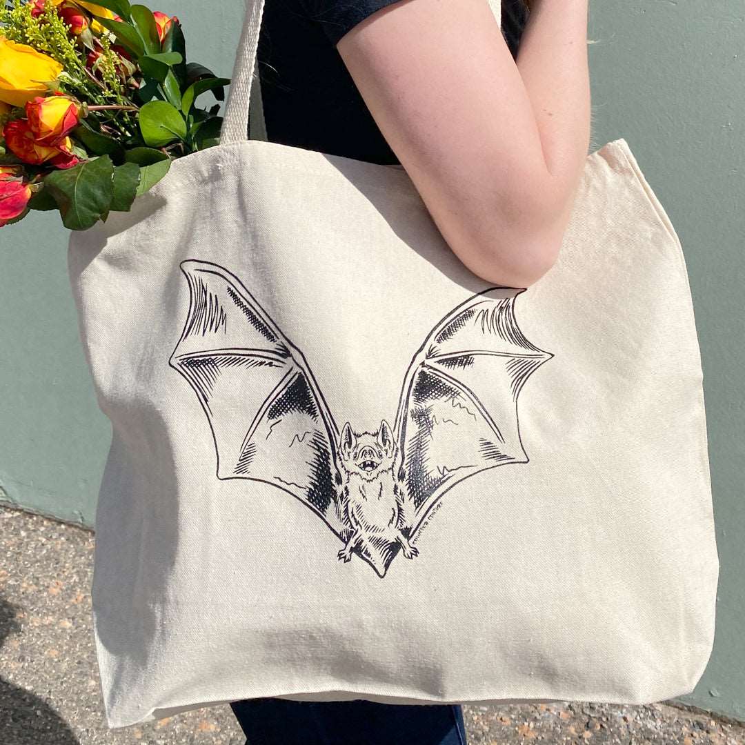 Counter Couture tote bag with black leather handles and spacious fabric body, stylish and functional for everyday use.