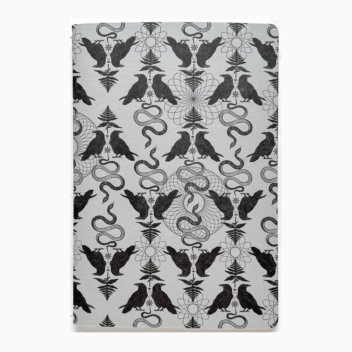 Blackbird Letterpress black leather jotter notebook with embossed logo and lined pages, perfect for writing and note-taking.