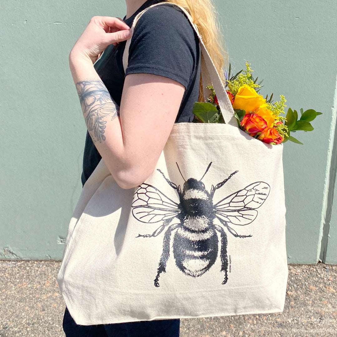 Counter Couture tote bag with stylish black and white geometric pattern, featuring two sturdy handles and spacious interior.