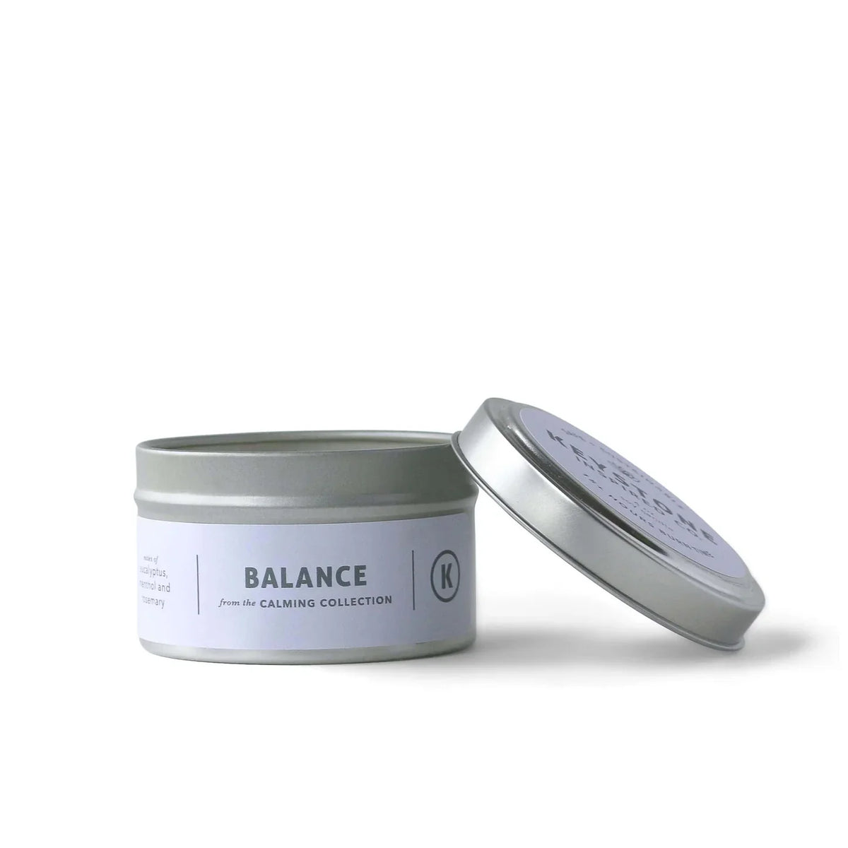 Keystone Inspired 4 oz soy candle in a travel tin with a warm, inviting scent and a simple, rustic design.