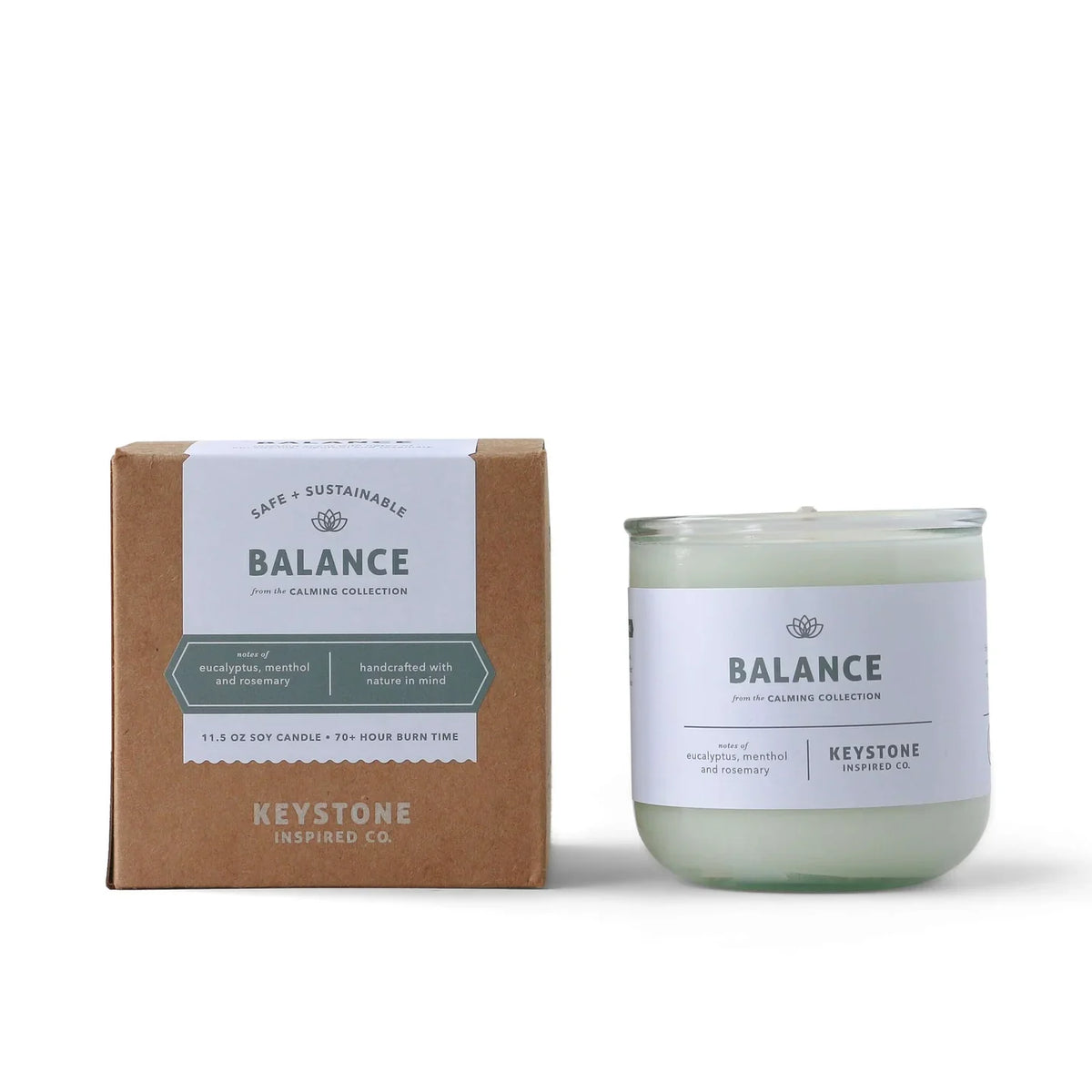 11.5 oz Keystone Inspired soy candle in a glass jar with a lit wick, showcasing a cozy and inviting ambiance.