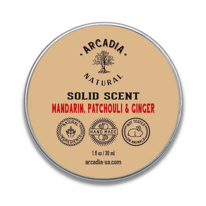 Natural solid perfume by Arcadia Naturals displayed in a sleek container, showcasing the elegant packaging and product details.