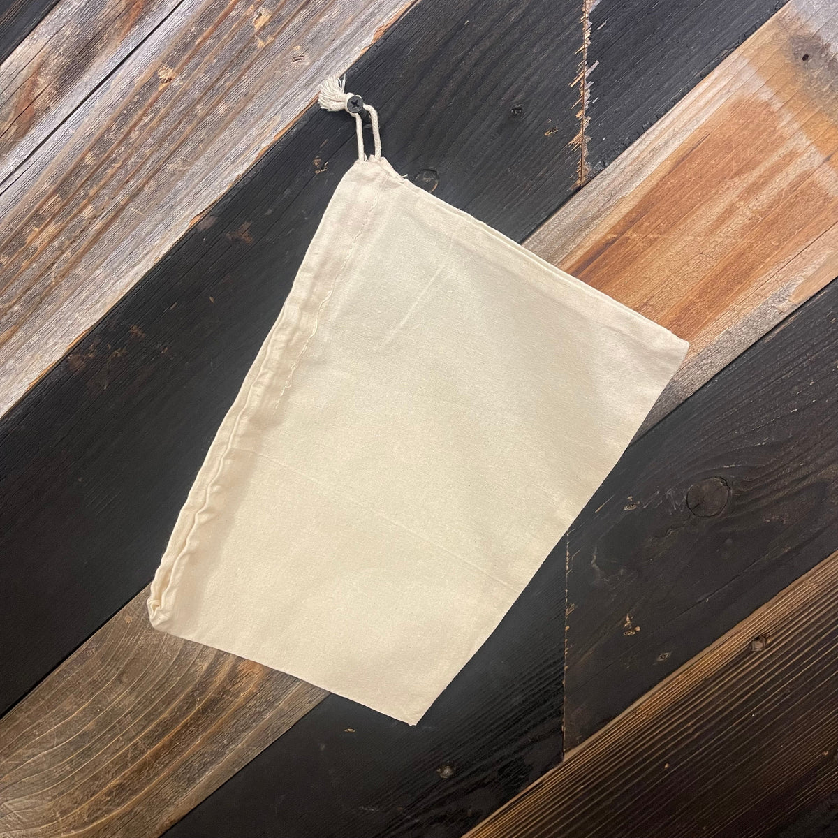 Cotton drawstring bag in various sizes by OTB Refills, featuring a natural fabric look with a secure drawstring closure.