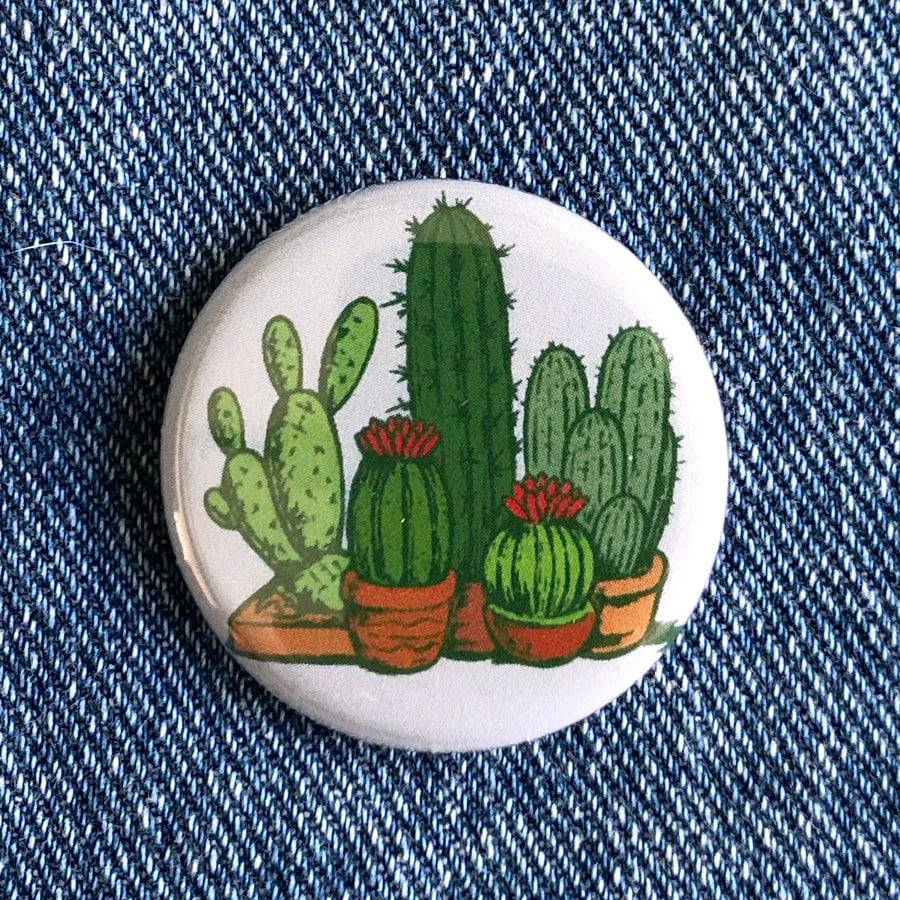 Counter Couture button with decorative design, close-up shot showing intricate details and vibrant colors.