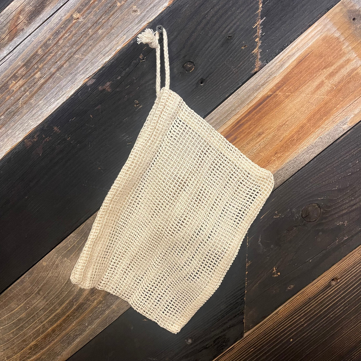 Cotton mesh bag by OTB Refills in various sizes, showing breathable fabric and versatile storage capacity.