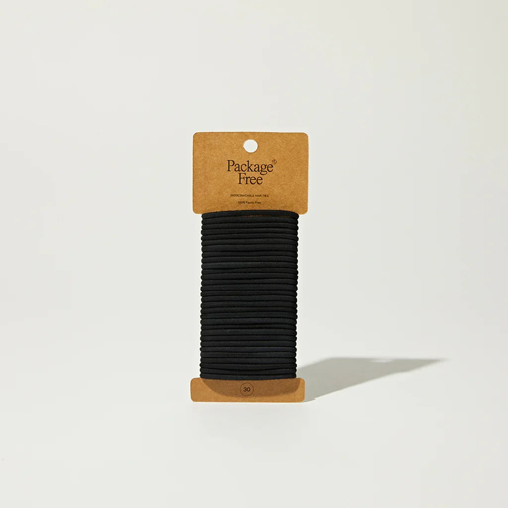 Set of 30 biodegradable hair ties from Package Free, showing eco-friendly elastic hair accessories in various colors.