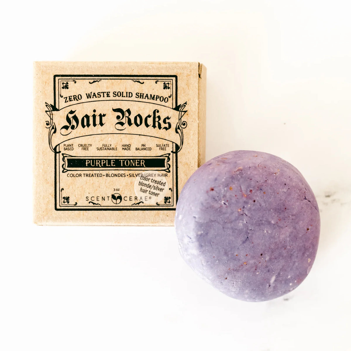 ScentCerae Hair Rocks natural shampoo bar with textured surface and eco-friendly packaging, designed for sustainable hair care.