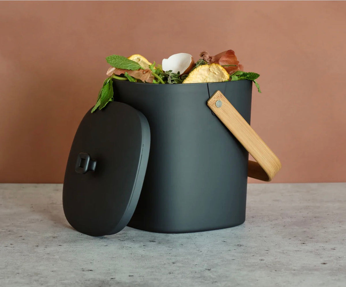 Bamboozle countertop composter in assorted colors with a sleek, modern design for kitchen composting.