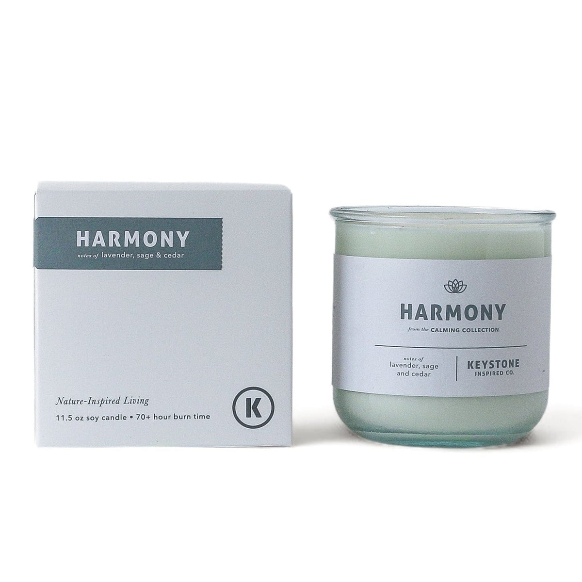 11.5 oz glass soy candle by Keystone Inspired with a white wax finish and a natural cotton wick, in a clear glass container.