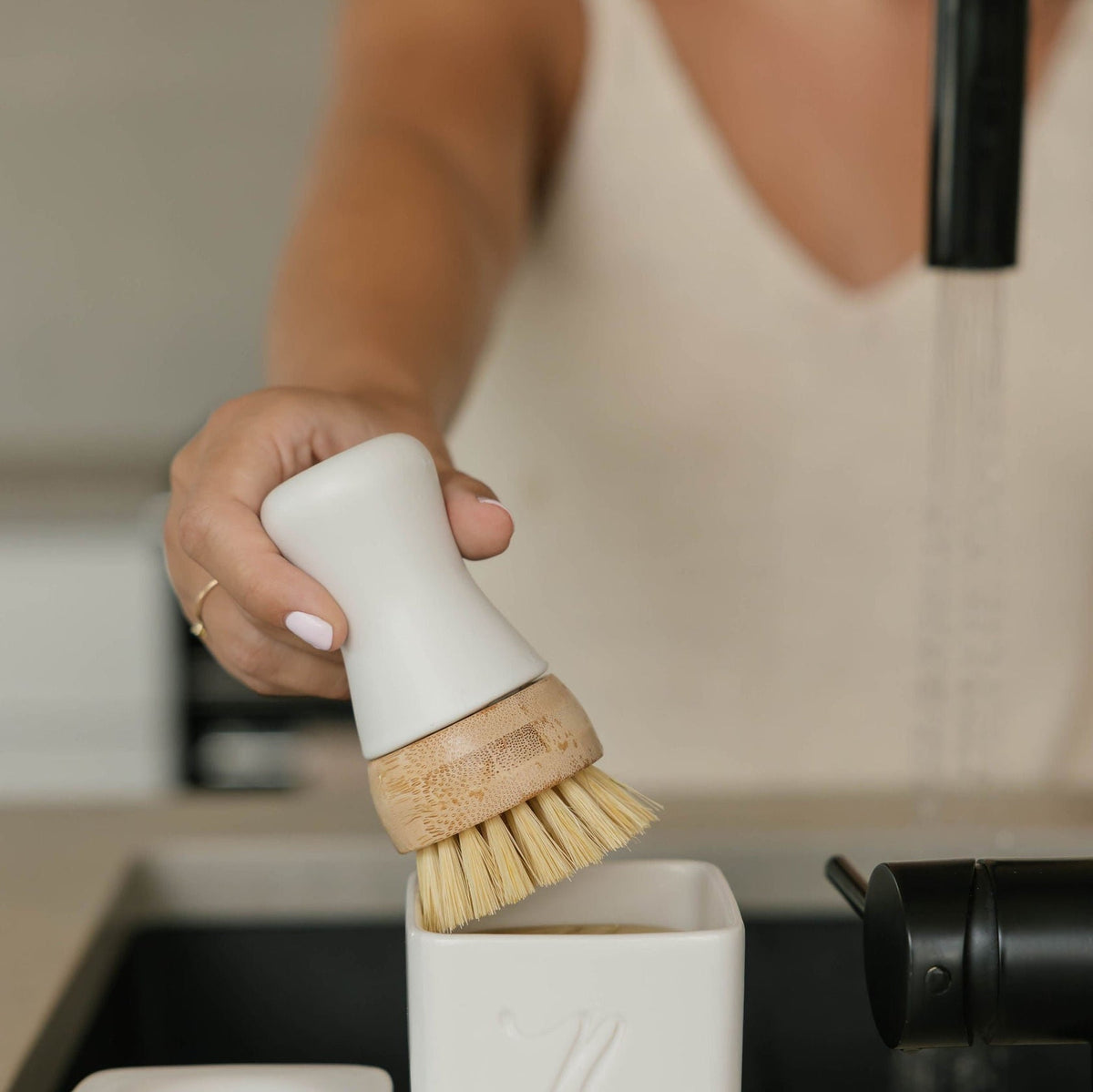 Nellie's Forever Brush with durable wooden handle and natural bristles, designed for cleaning and scrubbing surfaces.