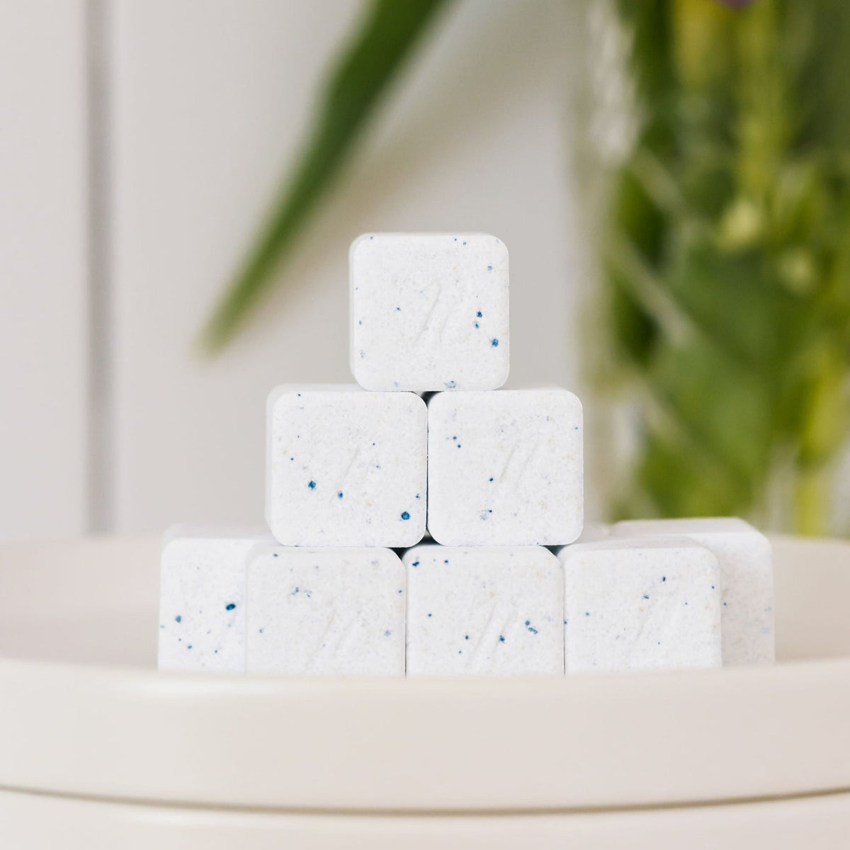 Nellie's Dishwasher Detergent Cubes in a clear container showing white, biodegradable cleaning cubes for dishwasher use