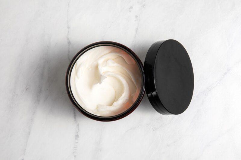 Humble Suds Scour Cleaning Paste in a tub, showing the creamy white paste ready for cleaning tough kitchen and bathroom surfaces.