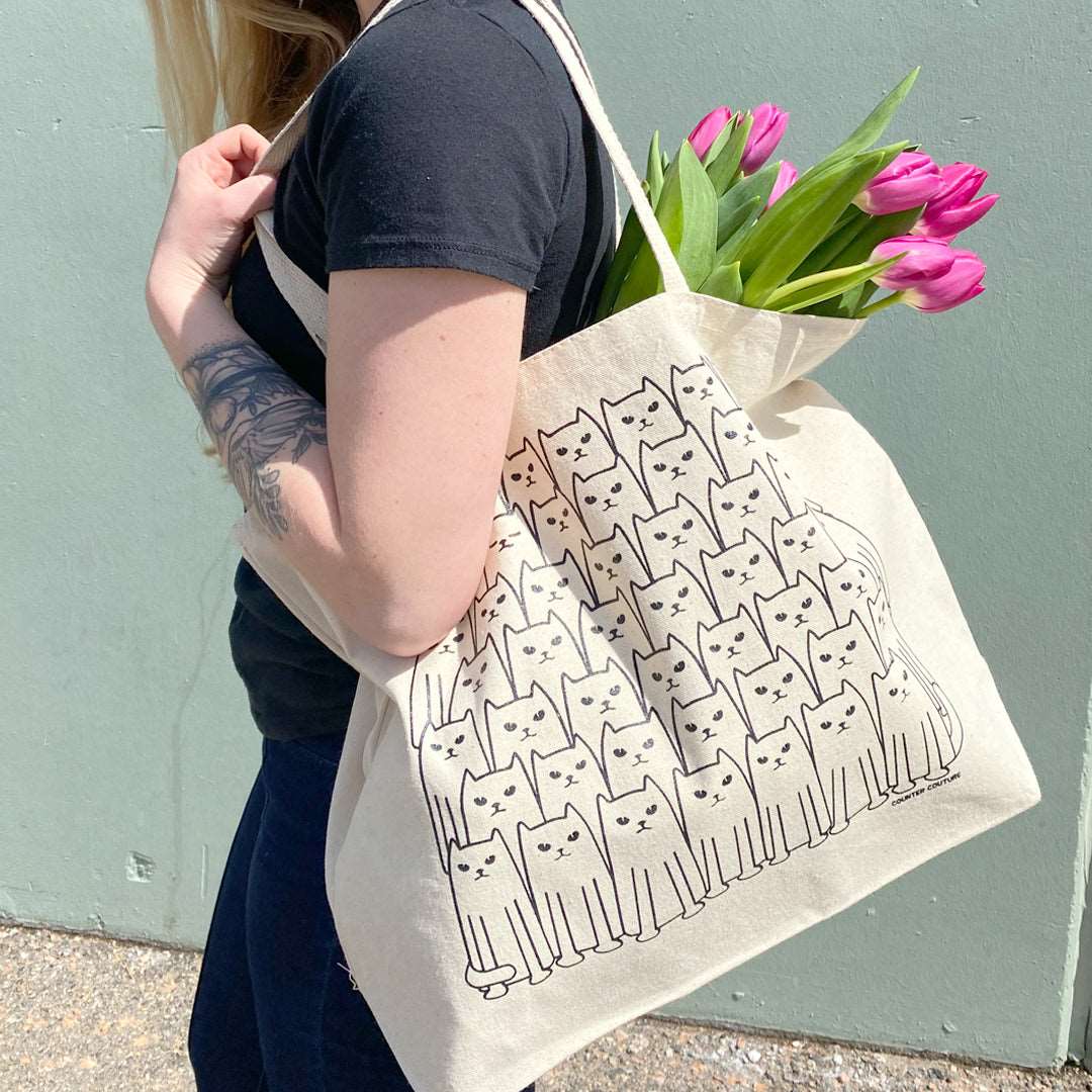 Counter Couture Tote bag with stylish black and white geometric pattern, featuring sturdy handles and spacious interior.