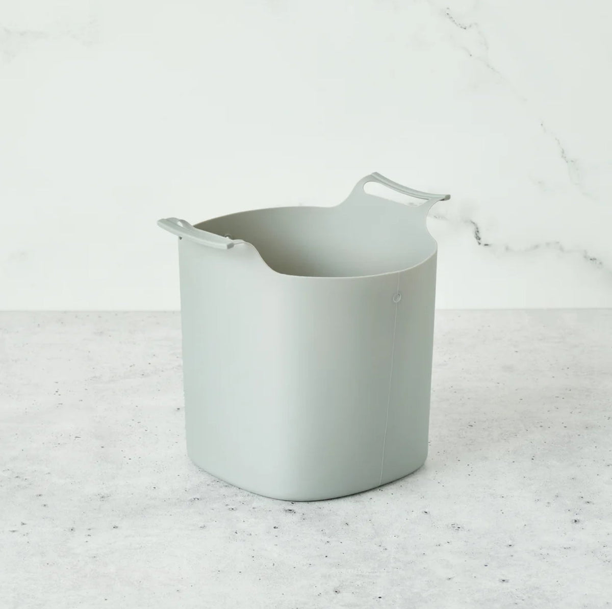 Silicone compost bin liner by Bamboozle, flexible and reusable for eco-friendly kitchen waste disposal.