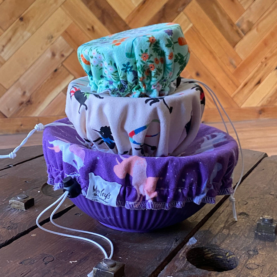 Set of three reusable bowl covers by Marley's Monsters in various sizes, made of breathable fabric for food storage.