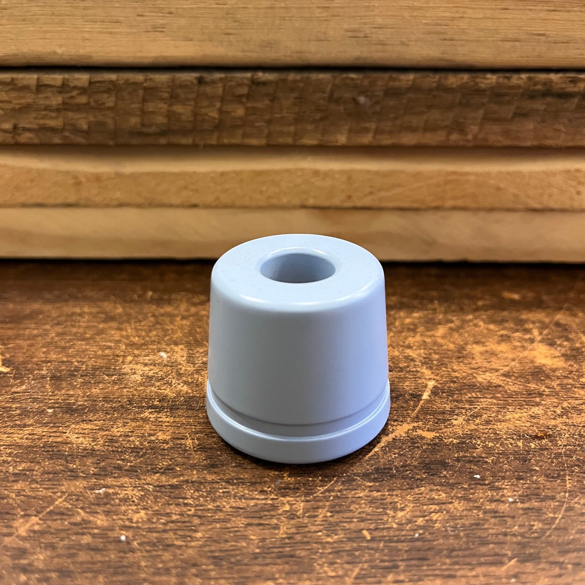 Metal razor stand by Ningbo Haward Razor holding a safety razor and shaving brush, sleek and durable for grooming accessories.
