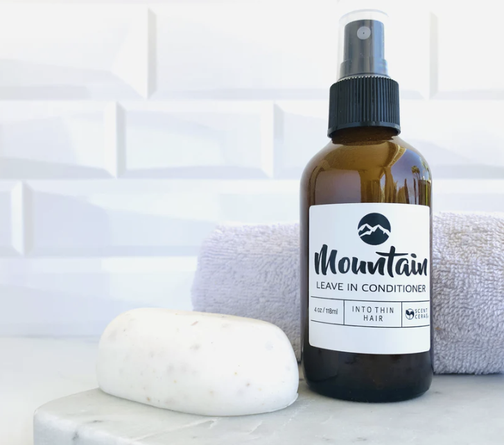 ScentCerae Island Leave-In Conditioner in a 4oz glass bottle, smooth and hydrating hair treatment with tropical scent.