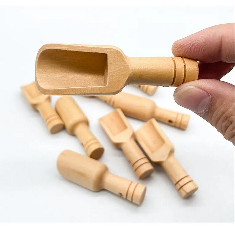 Small lotus wood scoop spoon by OTB Refills, 1 teaspoon size, showing smooth wooden handle and rounded scoop for precise measuring.