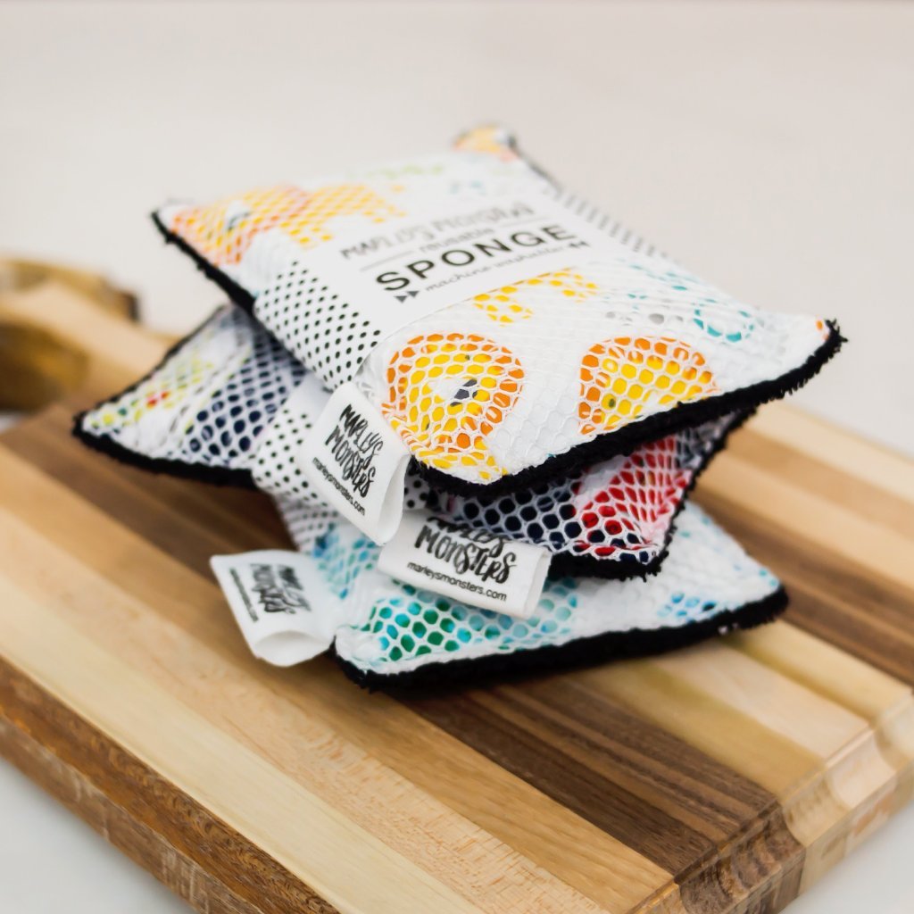 Reusable washable sponge from Marley's Monsters, soft and eco-friendly cleaning tool with a textured surface.