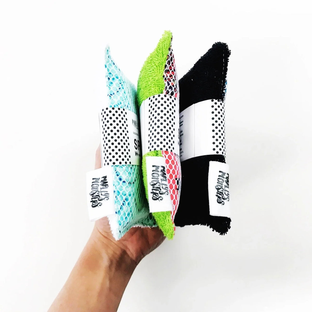 Reusable washable sponge by Marley's Monsters, showing a soft, absorbent cleaning sponge with a textured surface for household use.