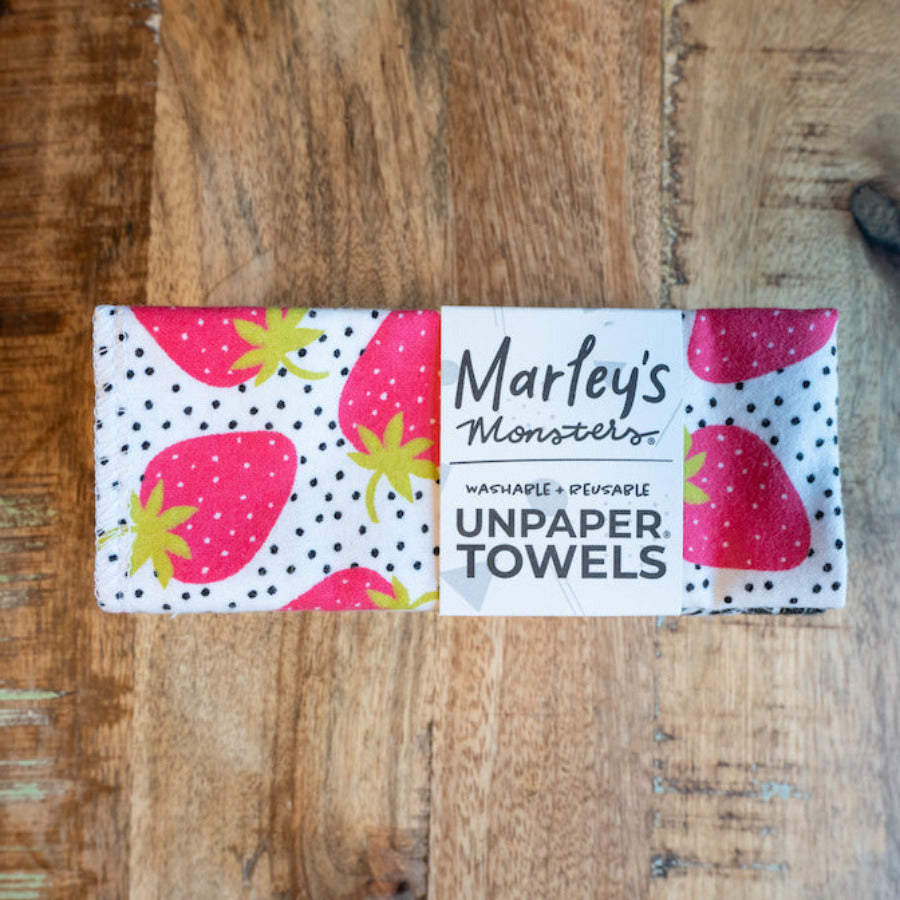 Six stacked Marley’s Monsters UNpaper Towels with colorful surprise prints, eco-friendly reusable paper towel set.