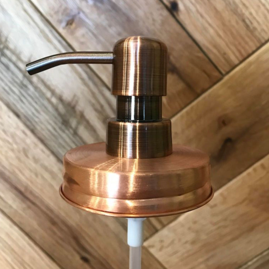 Copper mason jar soap and lotion pump with a regular mouth lid from One Dream Design, featuring a sleek, functional design.