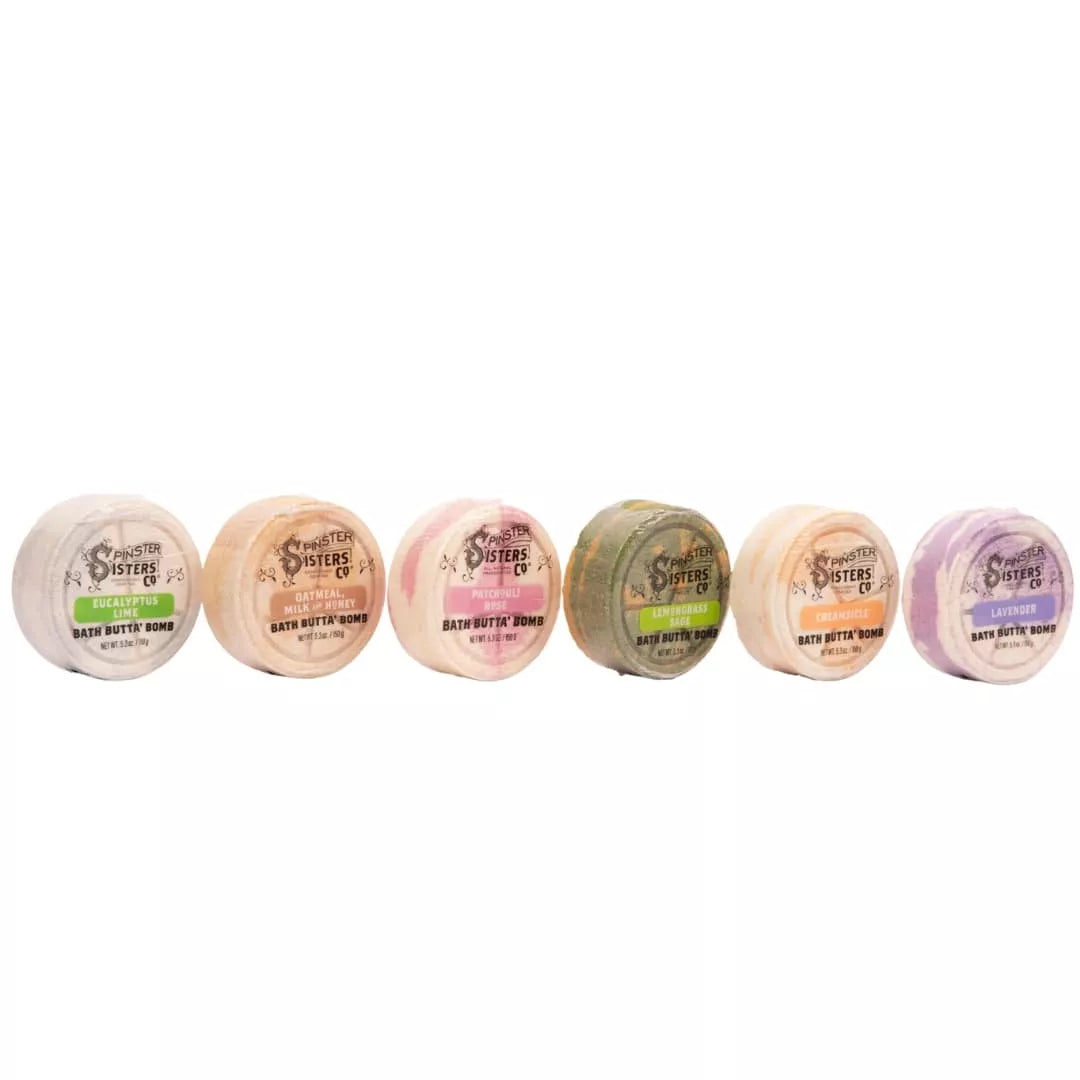 Group of Spinster Sisters Bath Butta' Bombs in various colors and shapes, ready for a relaxing bath experience.