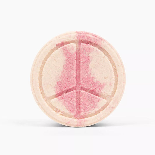 Spinster Sisters Bath Butta' Bomb with patchouli and rose scent, shown in a close-up image highlighting the textured, aromatic bath bomb.