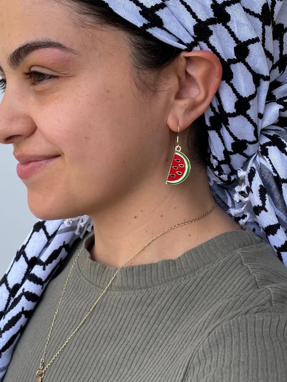Palestine Watermelon Drop Earrings by Stitch4pali featuring vibrant watermelon-shaped dangle earrings with green and red accents.