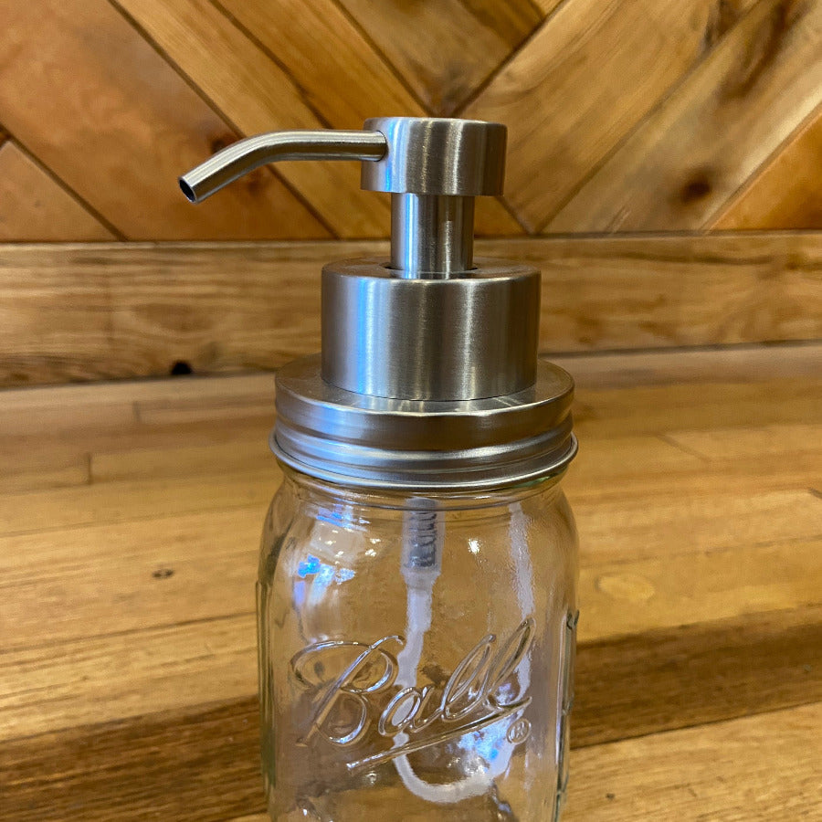One Dream Design foaming soap pump kit with mason jar adapter showing a clear plastic pump attached to a glass mason jar.