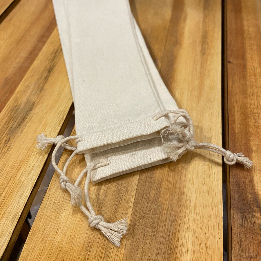 Long cotton travel bag by OTB Refills with straws and chopsticks, featuring a lightweight, eco-friendly design for on-the-go use.