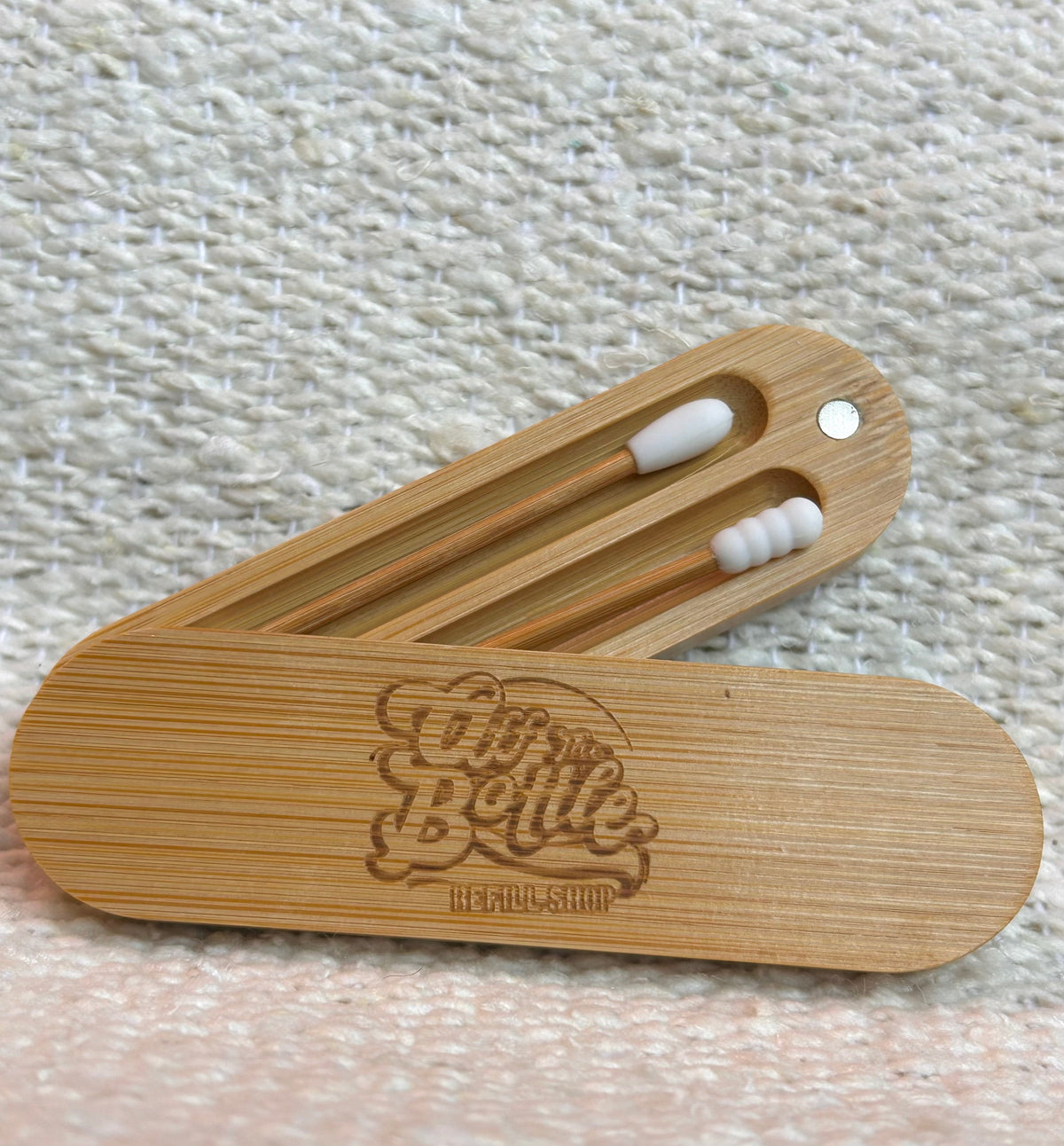 Reusable Q-Tip swabs from OTB Refills in a 2-pack, showing eco-friendly cotton swabs with bamboo handles for gentle ear cleaning.