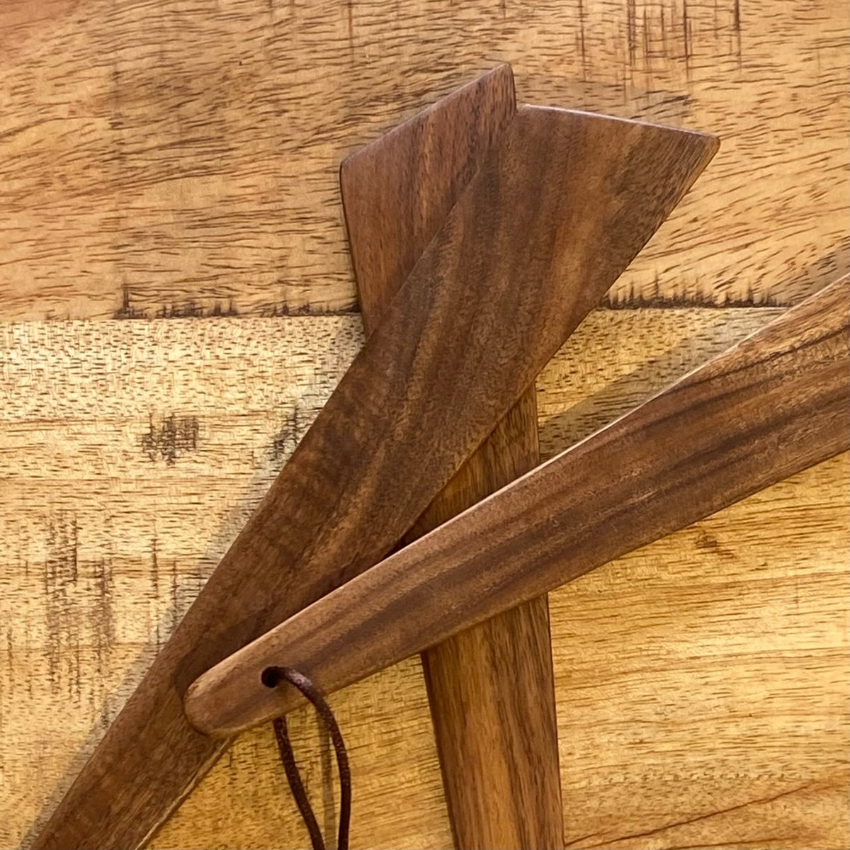 OTB Refills wood pan scraper with sturdy wooden handle and metal blade, ideal for cleaning and scraping cookware.