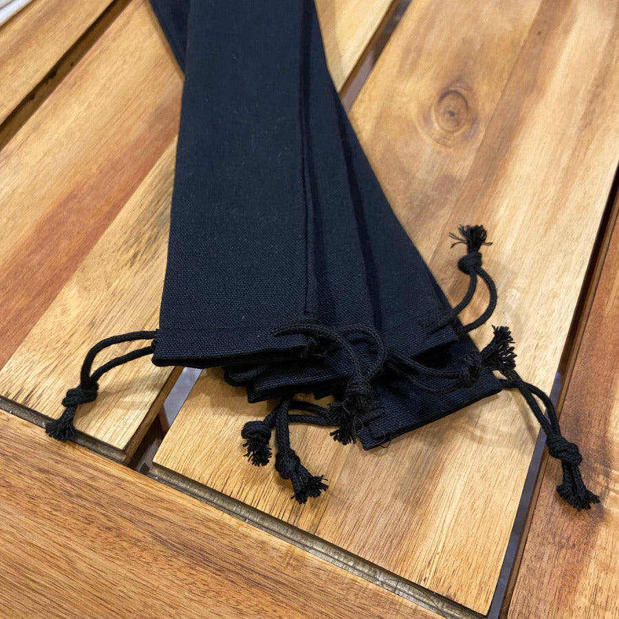 Long cotton travel bag from OTB Refills with built-in straws and chopsticks, perfect for eco-friendly travel and dining on the go.
