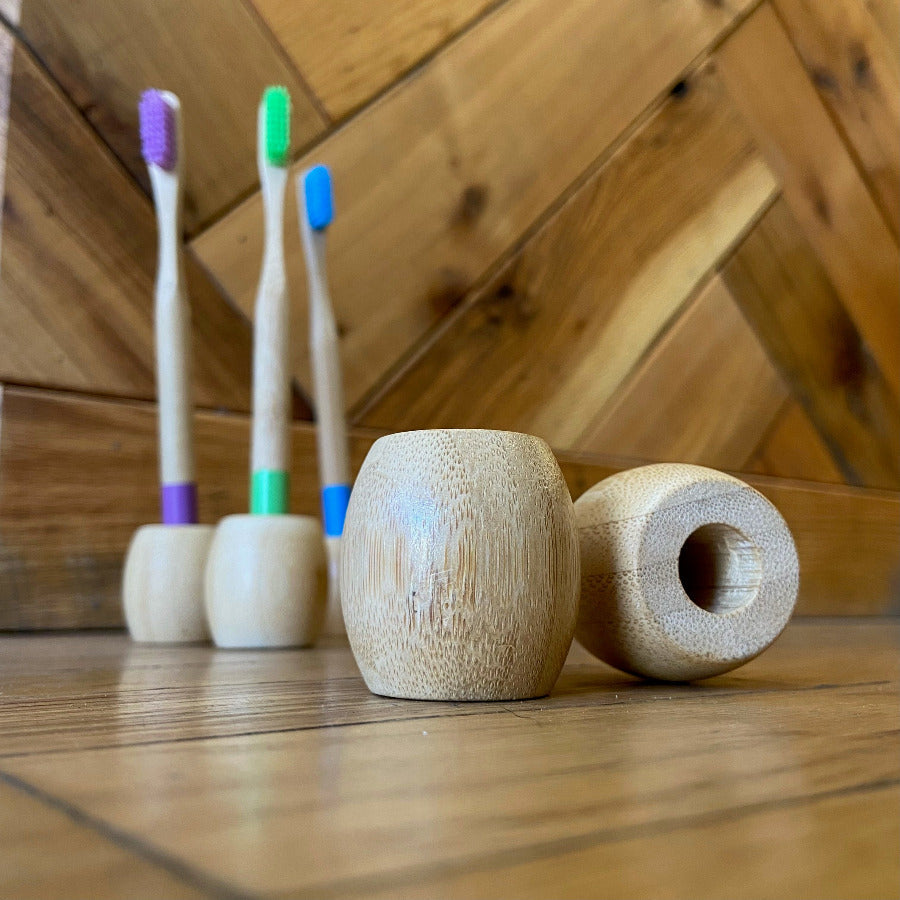 OTB Refills bamboo toothbrush stand with drainage holes and eco-friendly design for bathroom organization and toothbrush storage.