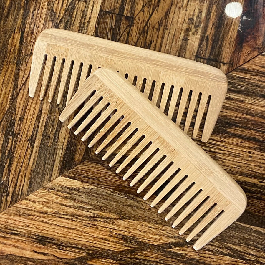 Wide teeth bamboo comb by OTB Refills, showcasing natural bamboo material and large teeth for gentle hair detangling.