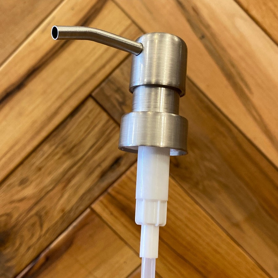 Stainless steel soap pump with bird head design by One Dream Design, featuring a sleek, modern kitchen or bathroom dispenser.