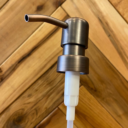 Stainless steel soap pump with bird head design by One Dream Design, featuring a sleek, modern bird-shaped spout for kitchen or bathroom use.